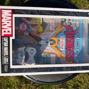 Marvel Captain Marvel Funko Pop with Red and Blue Avengers Comic Art